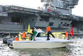 Citizens protest against deployment of nuclear-powered U.S. aircraft carrier
