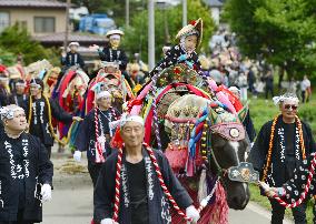 Participants walk at horse festival in northeastern Japan
