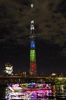 Tokyo Skytree lit up in 3 primary colors