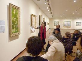 Dementia patients look at Bonnard painting at museum