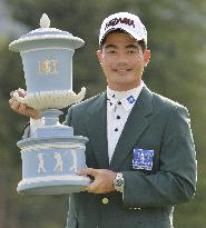 China's Liang holds trophy after winning Mori Building Cup