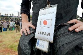 Japanese journalist hangs press ID showing nationality