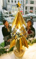 Gold Christmas tree shown in Tokyo's Ginza