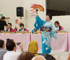 Kimono-clad Japanese woman dances to harp tune at Expo Milano