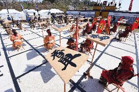 Shogi game played with 'human pieces' in Tendo