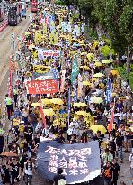 Thousands in H.K. march to protest electoral reform proposal