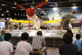 Visitors to museum for "kamikaze" suicide pilots listen to storyteller