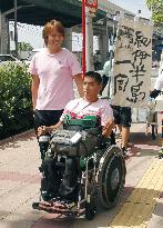 Man leaves on wheelchair trip around peninsula in west Japan