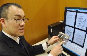 Professor shows microfiche on executed Japanese war criminals