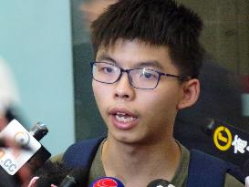 H.K. student activist Joshua Wong returns after detention in Thailand