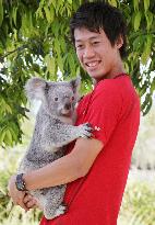 Japan's Nishikori cuddles koala in Australia