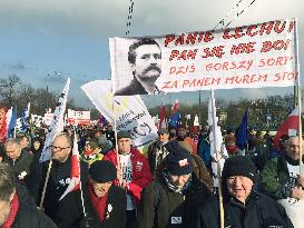 People rally in Warsaw for democracy icon Walesa