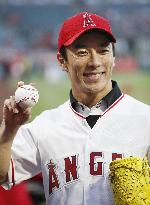 Baseball: Takuma Sato throws ceremonial first pitch