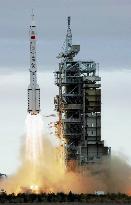 China launches 2 men into space