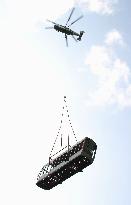 Helicopter transports new cable car