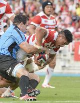 Japan forward Tui makes try in rugby test match against Uruguay