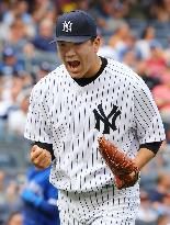 Tanaka helps Yankees avoid 4-game sweep against Blue Jays
