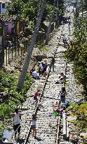 Quake-hit Chileans walk on tracks