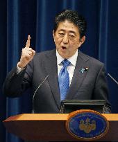 Abe announces sales tax hike delay to October 2019