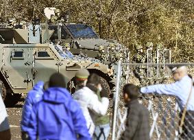 Media shown Japan troop drills to protect citizens abroad