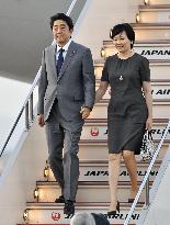 Japan's PM Abe returns to Tokyo after G-7 summit