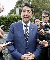 Japan PM Abe visit to father's grave