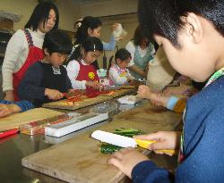 Children getting lessons in cooking, appreciation