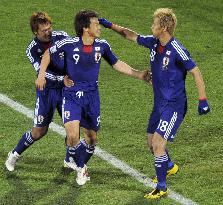 Japan overpower Denmark to cruise into last 16