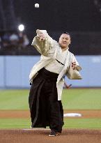 Sumo grand champion Hakuho throws ceremonial 1st pitch