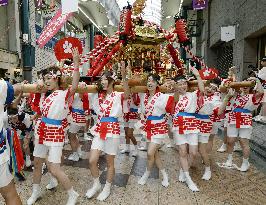 Women parade through Osaka shopping street with portable shrines