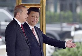 Chinese President Xi greets visiting Turkish President Erdogan