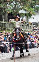 Archer aims arrow on galloping horse at shrine festival in Nikko