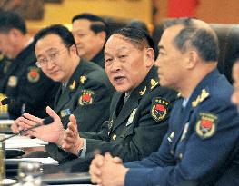 Japanese, Chinese defense chiefs hold talks in Beijing
