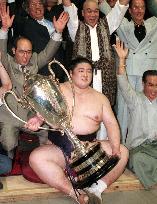 Dejima holds trophy for Nagoya sumo triumph