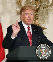 Trump warns U.S. may have to "totally destroy" N. Korea