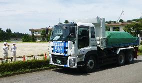Truck carries waste from decontamination work in Fukushima