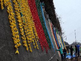 Rainbow origami cranes from world cheer up tsunami-ravaged city