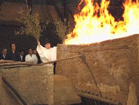 Shinto priest performing purification ceremony