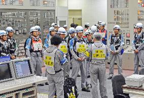 Workers conduct disaster drill at nuclear plant in southern Japan