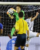 Japan goalie Nishikawa makes save in game against Cambodia