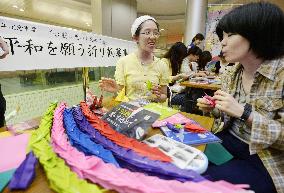 Osaka subway users make paper cranes to wish for peace