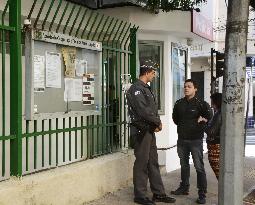 Brazilian policeman talks with citizen at Sao Paulo "koban"