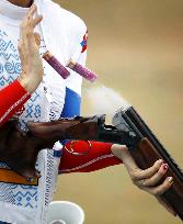 Olympic scenes: Skeet shooter removes shells