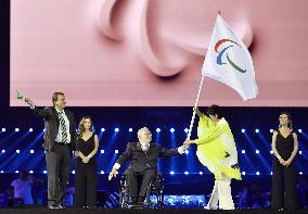 Tokyo Gov. Koike waves Paralympic flag at closing ceremony