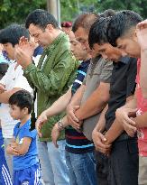 Ethnic Uyghurs following Ramadan in Urumqi