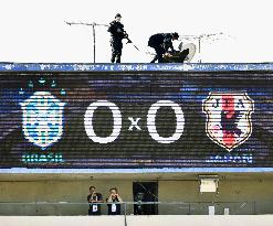 Snipers above scoreboard