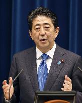 Abe announces sales tax hike delay to October 2019