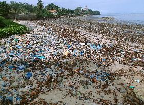 Ocean plastic waste pollutes seashore in Guinea