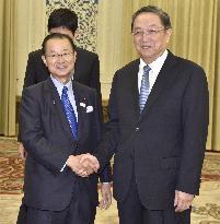 Japanese lawmaker meets China's No. 4 leader