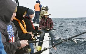 Ex-serviceman's tours near base drawing U.S. military folk in Japan